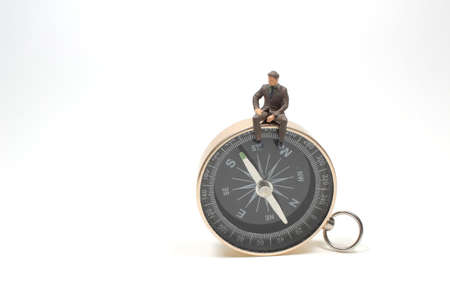 the figure of business man with the compass