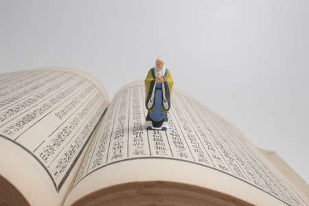 the figure old man stand on the chinese calligraphy bookの写真素材