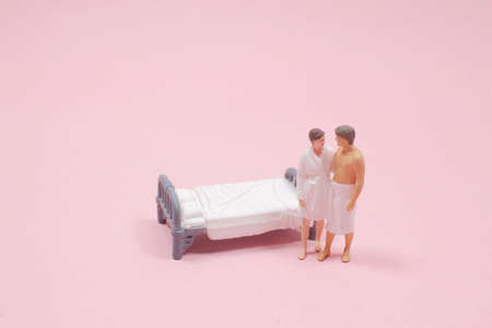 the lover figure stand on the bed behindの写真素材