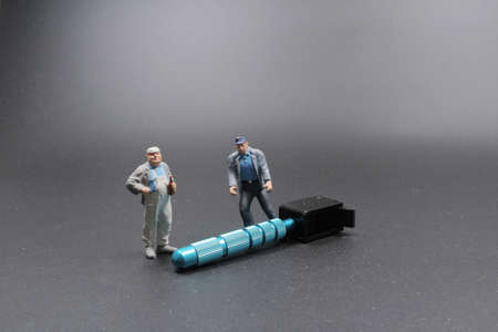 a Miniature people engineer and worker occupationの写真素材