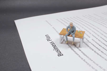 the mini of business figure on the business plan paperの写真素材