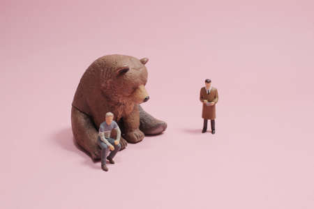 the mini figure of business with bearの写真素材