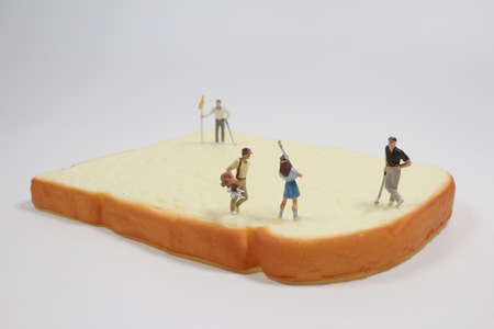 the mini figure play the golf on on Bread