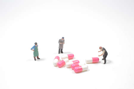 the mini of fun people workers moving capsules pills
