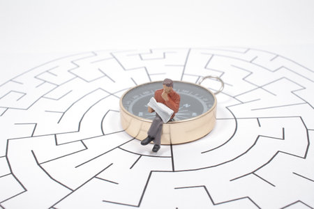 Businessman in the labyrinth or maze figuring out the way out. Business concepの写真素材
