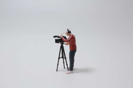 the figure of man taking video nextの写真素材