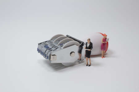 the figure with Office Stamp with Four Rolling Wheels with business peopleの写真素材