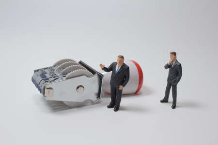 the figure with Office Stamp with Four Rolling Wheels with business peopleの写真素材