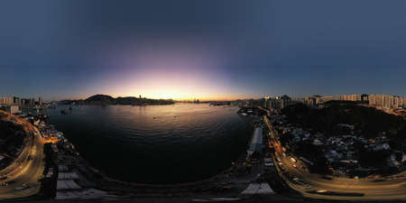 1 Dec 2021 Victoria Harbour, Hong Kong skyline at sunsetの写真素材