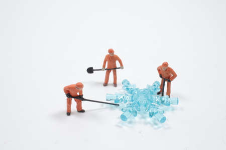 the small of gorup figure worker sweep snowの写真素材