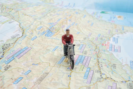 Travel Concept. Group of traveler miniature figures ride motorcycle