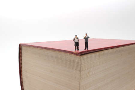 the mini figures businessman, man on book surface