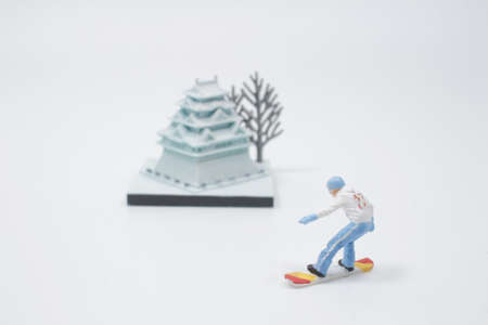 The mini snowboarding sportsman in snow action and motionの写真素材