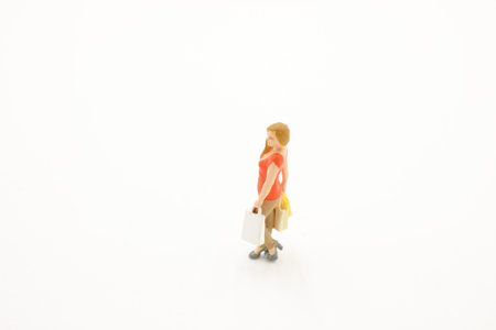 a mini of woman holding shopping bags