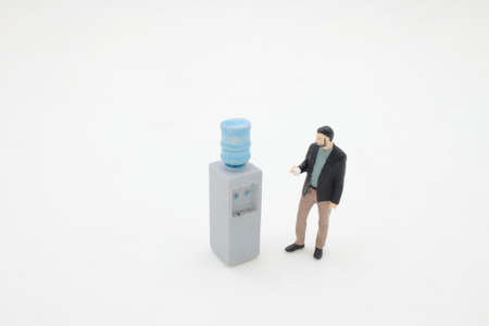the mini Business people standing by water coolerの写真素材