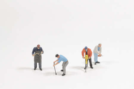 mini people group of labor isolated on white backgroundの写真素材