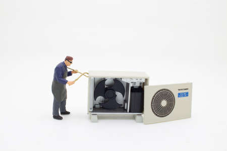 the mini figure Electrician operator inspect and checking heating ventilatedの写真素材