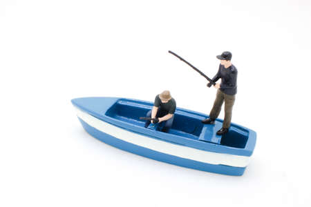 the Casting For Fish, fisherman fishing from the boatの写真素材
