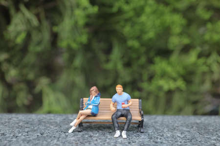 the lover figure chatting on park benchの写真素材