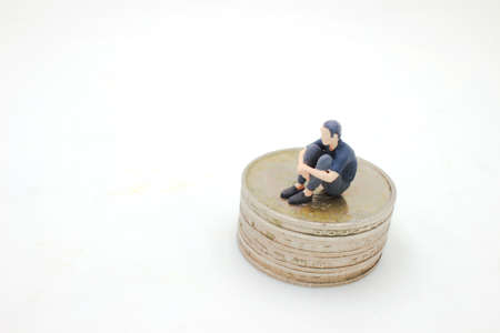 figure of homeless male begging sit on the coinsの写真素材
