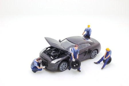 the Professional car mechanic replace tire on wheel in auto repairの写真素材