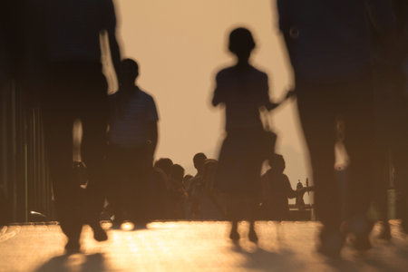 15 OCT 2011 Silhouettes of people walking at the Promenade, hk