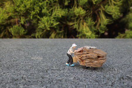a mini figure pushes a trolley laden with bags through
