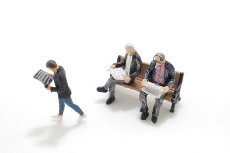 the figure of a man reading a newspaperの写真素材