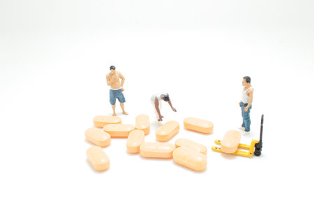 The worker at work with medicine pills