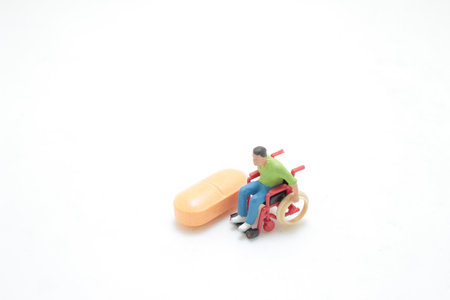 the mini figure of wheelchair with pillの写真素材