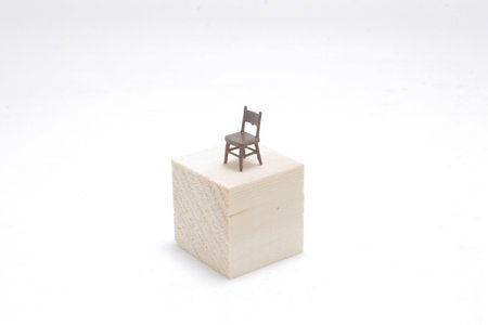 the chair alone on the wood cubeの写真素材