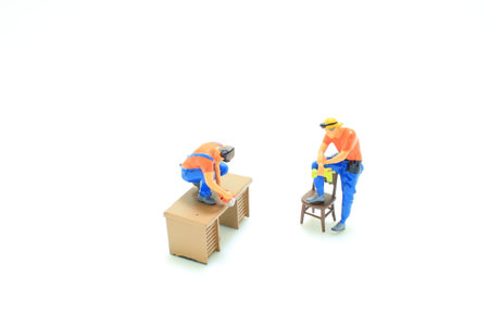 Group of carpenters at wooden workshop making furnitureの写真素材