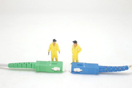 a Macro Fiber optic patchcord with the figure worker