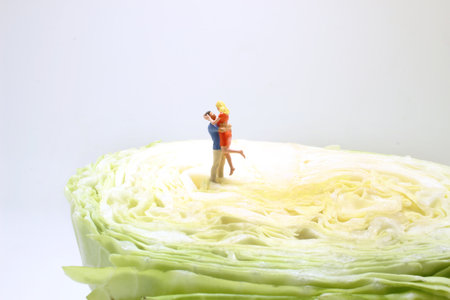 the fun of figure hug and stand together on Cabbage