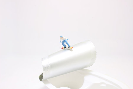 a Skier Snowboarder jumping through food packageの写真素材