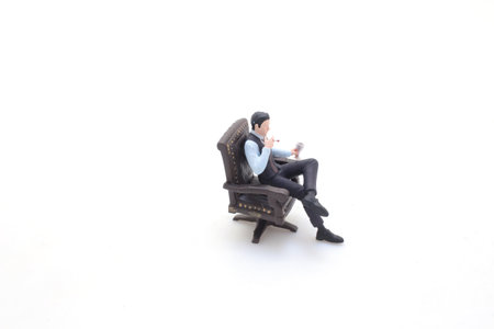 Portrait of bearded man enjoying cigar and glass of whiskeyの写真素材