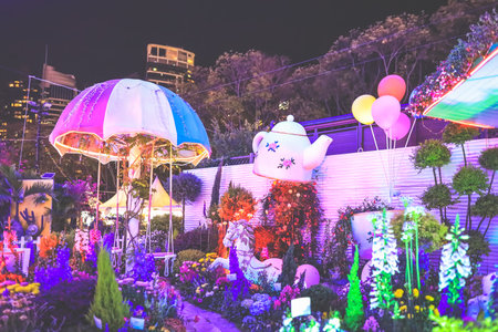 the romantic garden with roses and garlands and lanternの写真素材