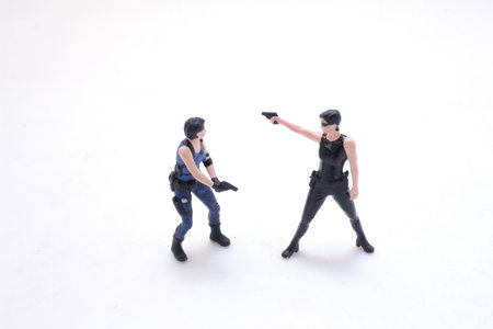 a girl in an action movie film shootout poseの写真素材