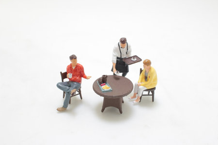 a figure enjoy the table with food at restaurantの写真素材