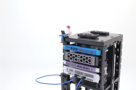 a mini figure using Laptop on the severの写真素材