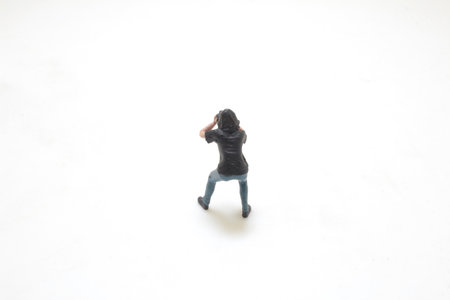 a fun of mini photographer figure are shooting
