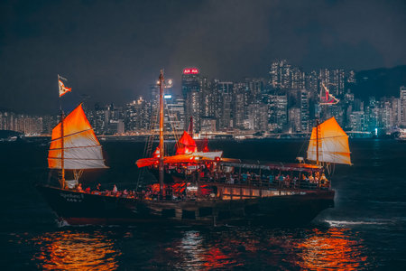 Victoria Harbour Hong Kong night view with junk ship Oct 17 2024