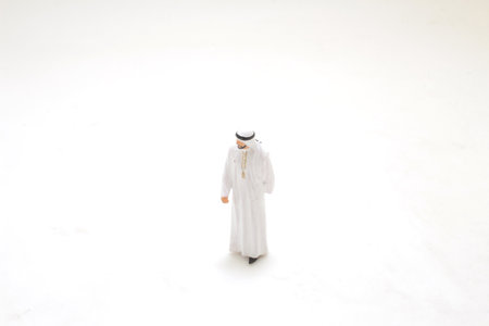 small figurine of a woman wearing traditional attire, set against a minimalisticの写真素材
