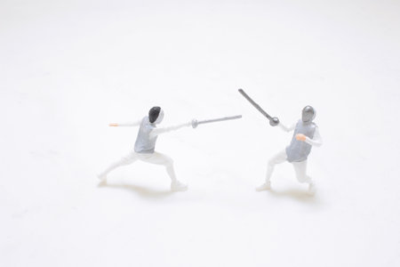 miniature figures capture the dynamics of a fencing duel, showcasing precisionの写真素材