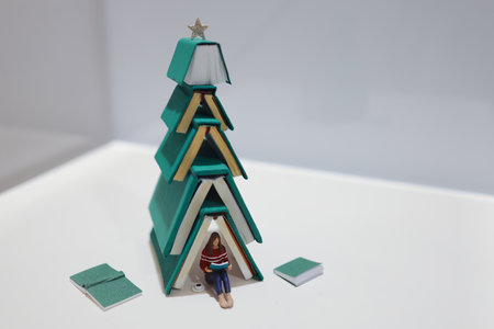 Creative Book Christmas Tree with Reading Figure Underneath Nov 22 2024