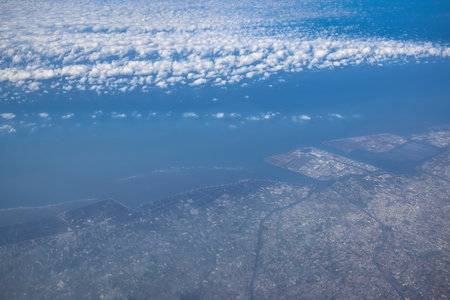 Dec 3 2024 aerial perspective showcasing a vibrant coastal city adjacentの写真素材
