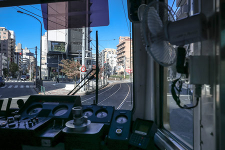 Dec 6 2024 view of a train cabin heading down a railway line with urban scenery outsideの写真素材