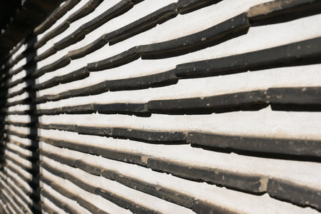 Dec 5 2024 Layered slate detail captured on a traditional decorative wall,