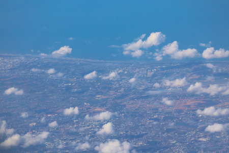 Dec 3 2024 shows a city surrounded by agricultural fields, rivers, and hills