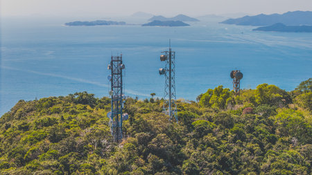 Feb 9 2025 Elevated telecommunications towers on a hill surrounded